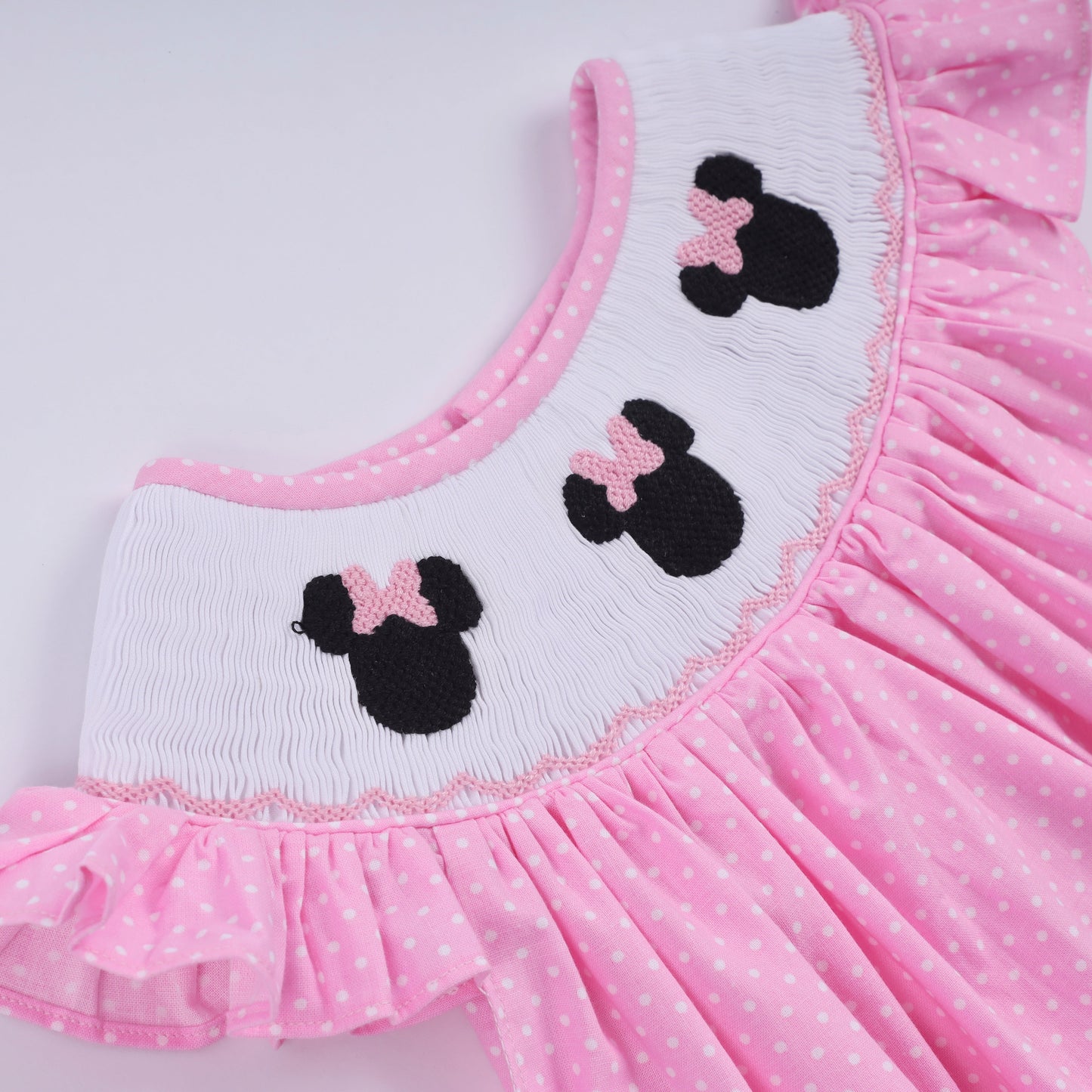 Pink character hand smocked dot ruffle dress